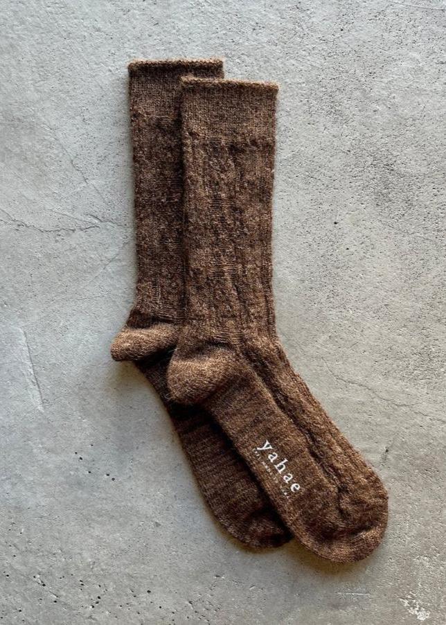 Cable knit socks by Yahae