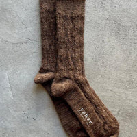 Cable knit socks by Yahae