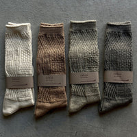 Mosaic textured socks by Yahae