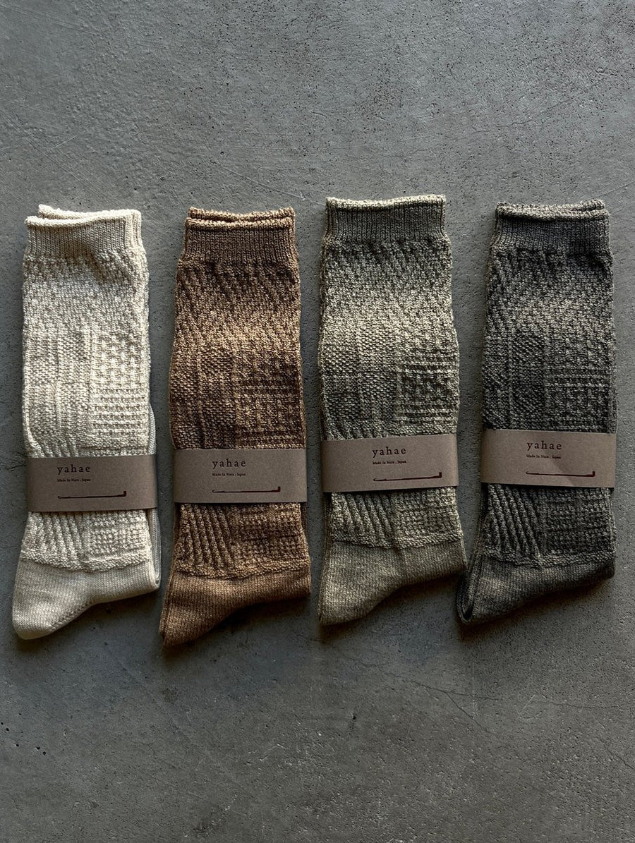 Mosaic textured socks by Yahae