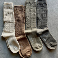 Mosaic textured socks by Yahae