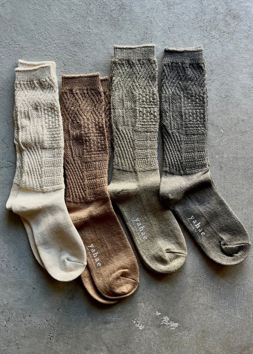 Mosaic textured socks by Yahae