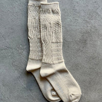 Mosaic textured socks by Yahae