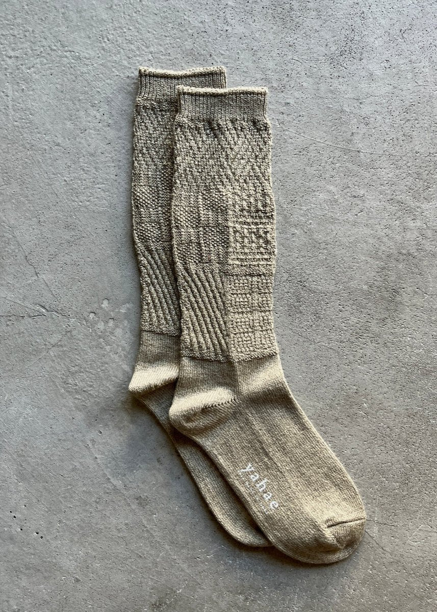 Mosaic textured socks by Yahae