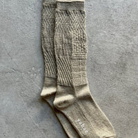 Mosaic textured socks by Yahae