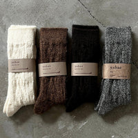 Cable knit socks by Yahae