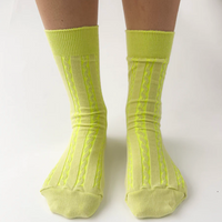 Twisted knit socks by OKAYOK