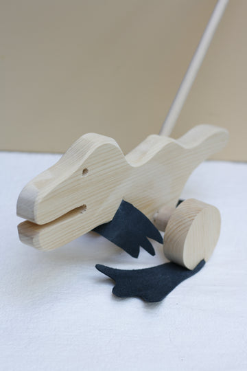 Wooden Dino push toy by Thorpe Toys